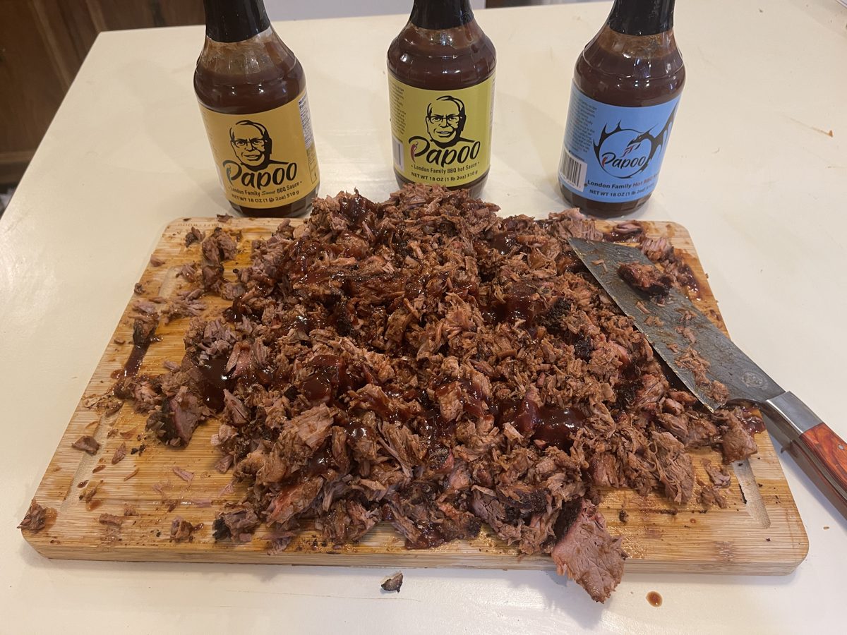Chopped brisket with three bottles of Papoo's