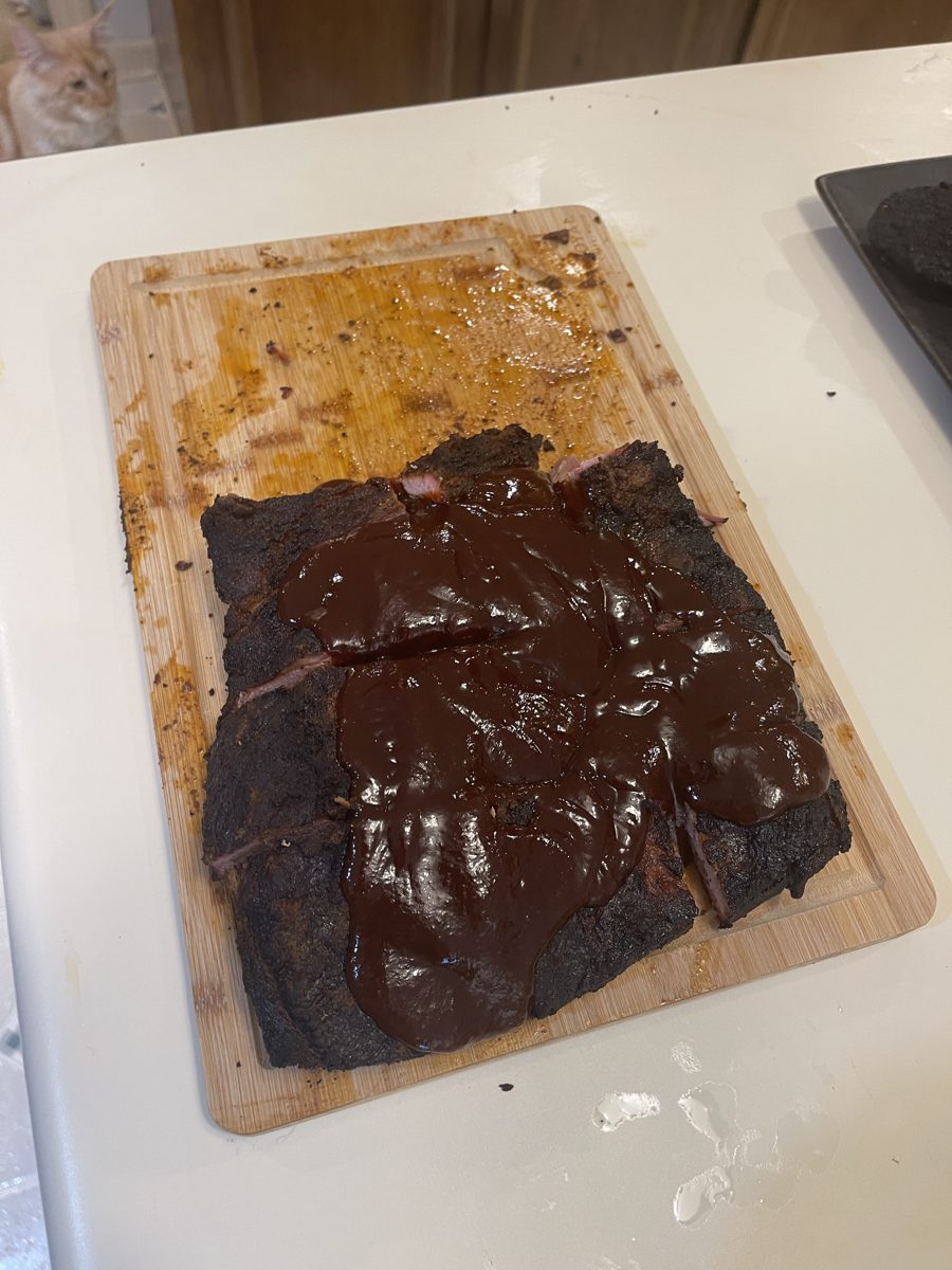 Smoked brisket brushed with Papoo's BBQ Sauce