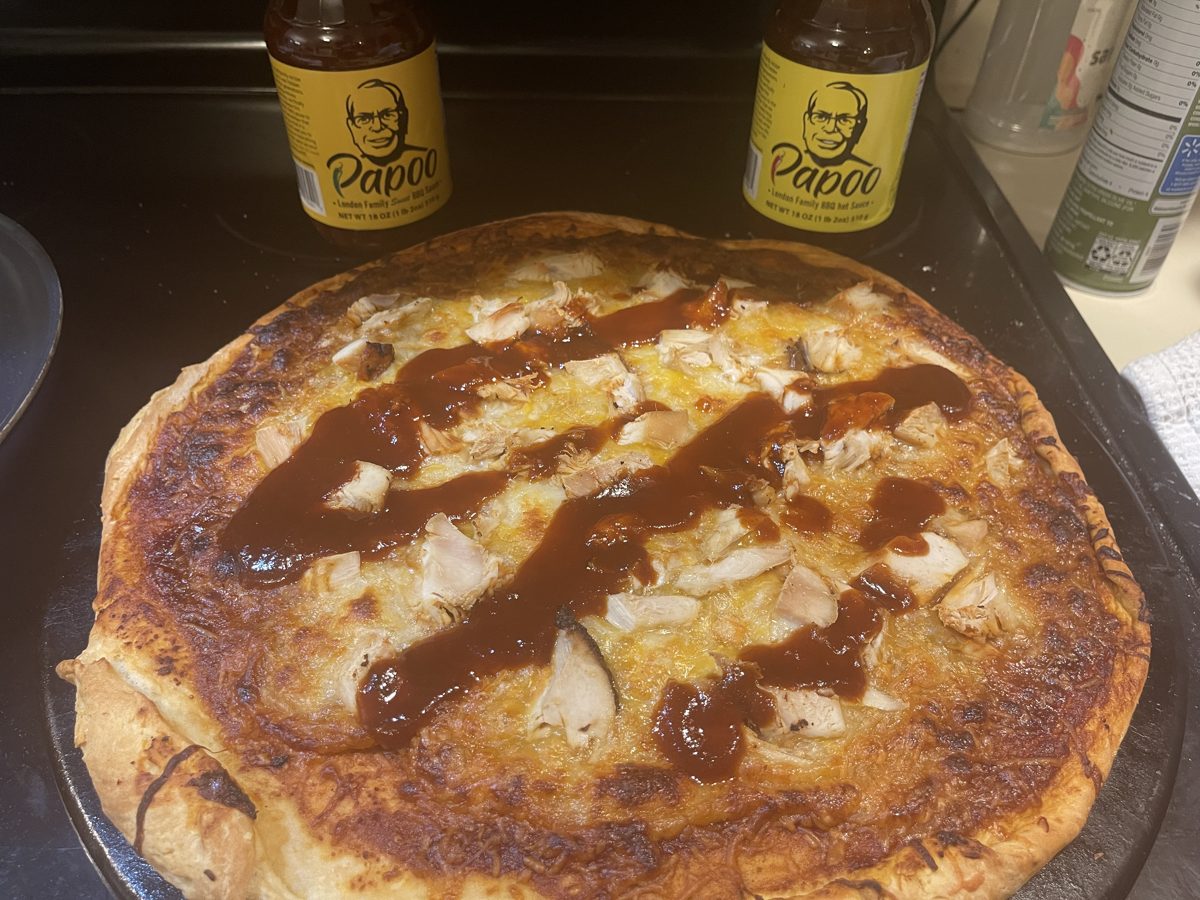 Finished BBQ chicken pizza drizzled with more sauce